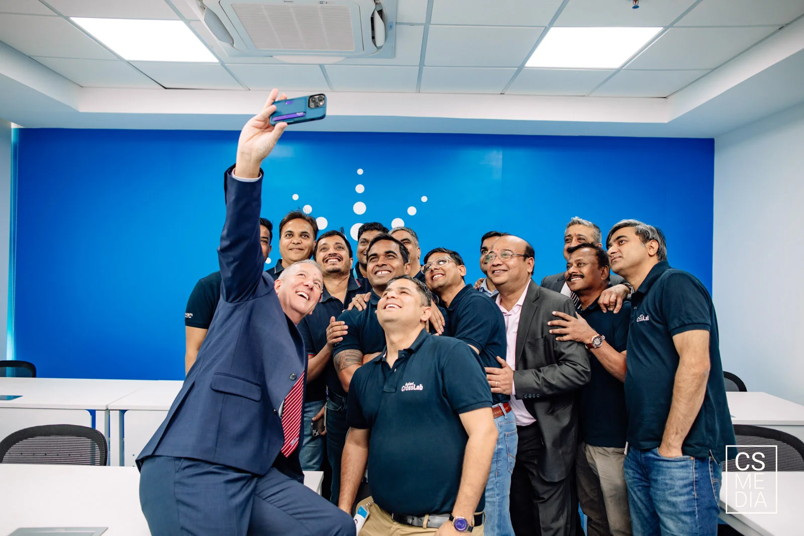 Corporate Lifestyle Photography capturing employees enjoying a candid selfie moment for social media content.